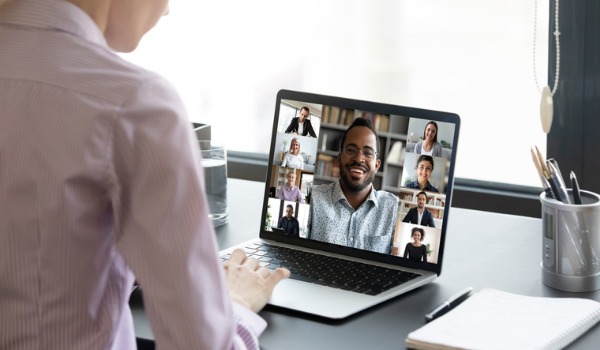 woman-worker-engaged-in-online-team-briefing-on-computer-picture-id1222279363